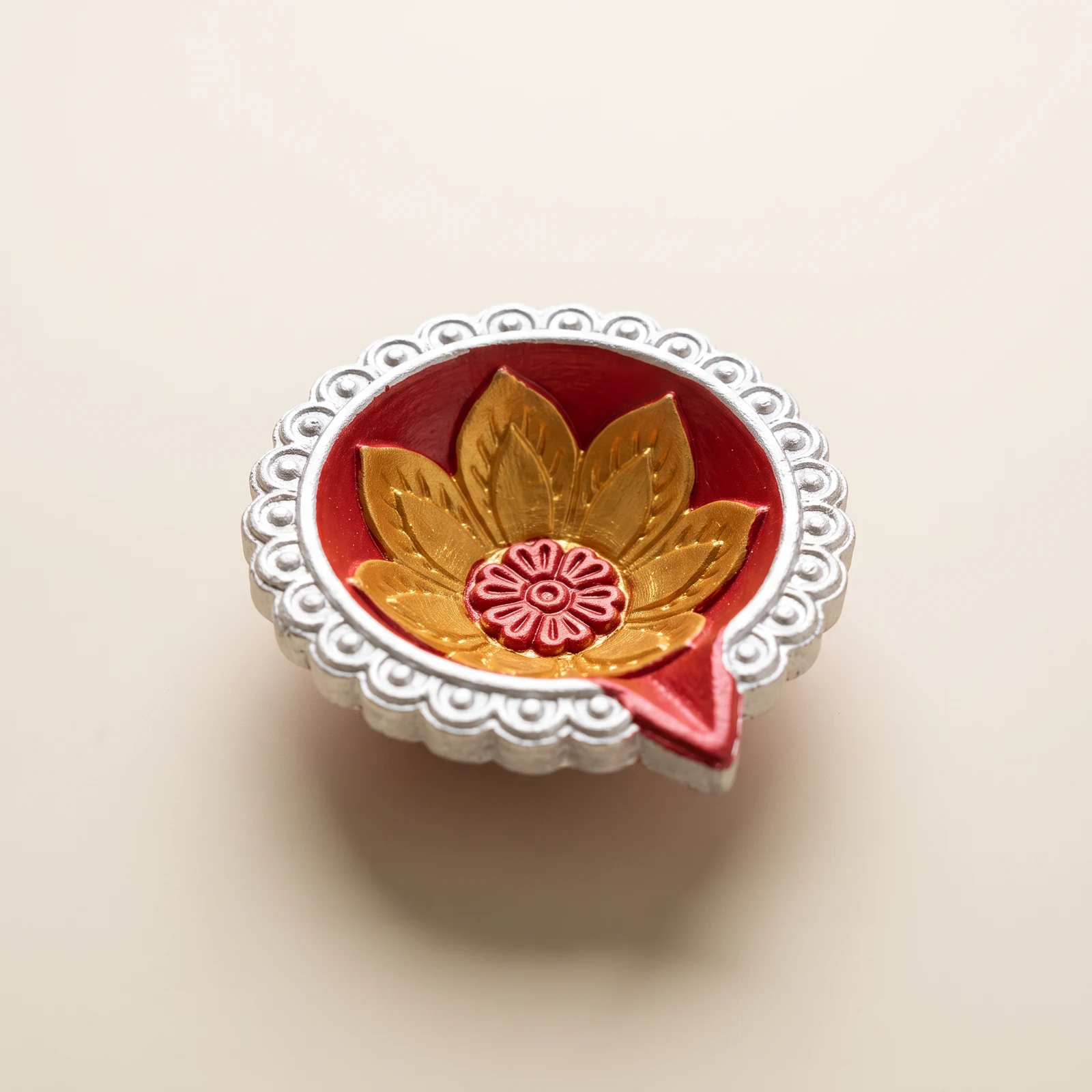 Red, Silver & Gold Lotus Diya — handmade details on an ivory background